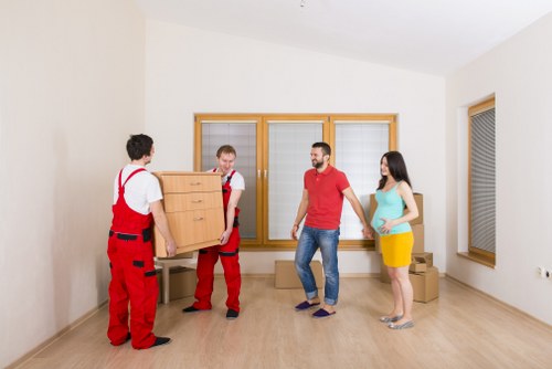 Packed moving boxes and furniture ready for collection