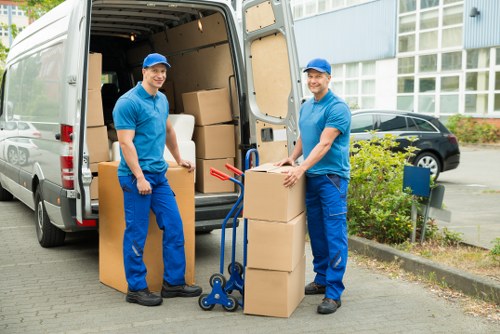 Packed moving boxes and furniture ready for loading in West Wickham