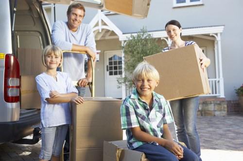 Commercial furniture and office items being loaded for transport