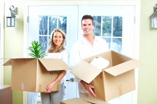 Packed moving boxes and furniture prepared for a local home removal